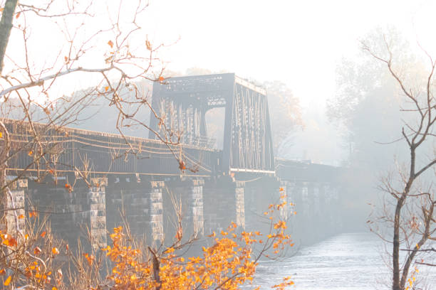 istock Railroad bridge on a foggy morning 1284760621