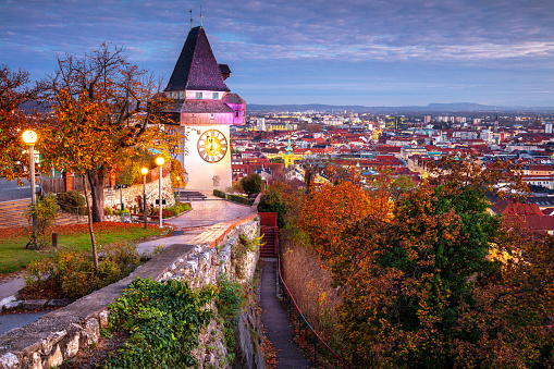 Cityscape image of the Graz, Austria with the Clock Tower at beautiful autumn sunset.