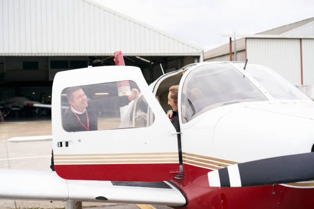 istock Man talking to a woman in a plane 1284761107