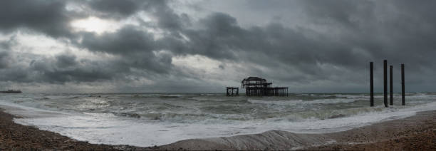 istock Brighton's stoney beach and West Pier ruins, England 1284761832