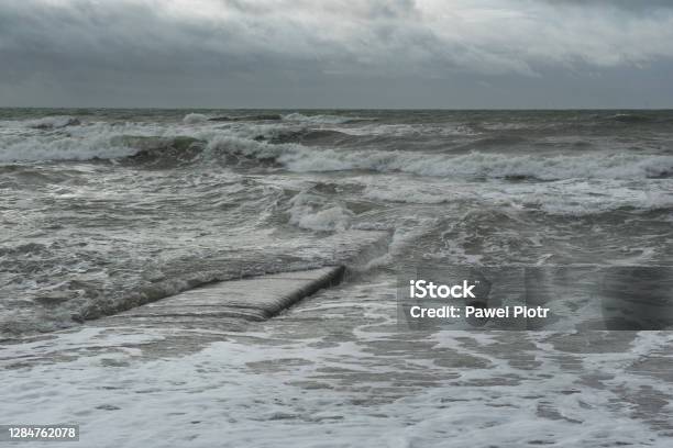 A Sea Waves Covers A Concrete Groyne Stromy Weather In Brighton Stock Photo - Download Image Now