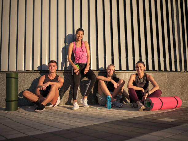 istock Smiling young multiracial sportive people after workout 1284762448