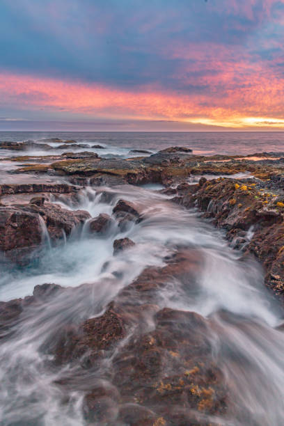 istock Sunset over the oceanside - Kona, Hawaii 1284763826