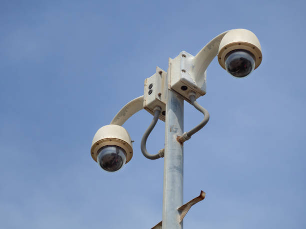 istock 360 Degree fish eye dome CCTV is installed on column against blue sky. 1284764083
