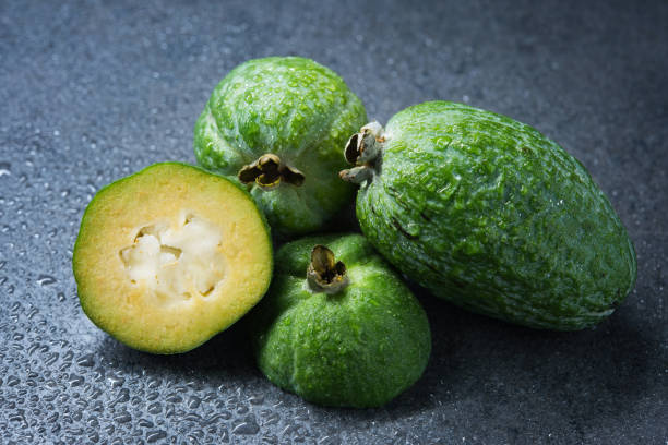istock Tropical fruit feijoa (Acca sellowiana) on gray background. Healthy food. 1284764262
