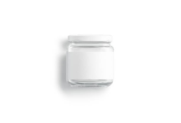 白いラベルのモックアップが横たわっている空白の小さなガラス瓶、孤立 - can label blank packaging ストックフォトと画像