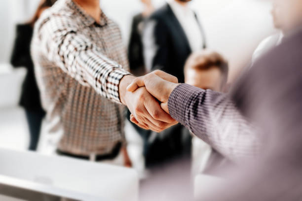istock close up. young business people shaking hands with each other 1284765748