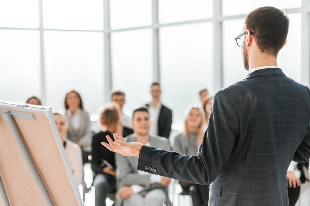 istock business man makes a report in the conference room 1284766641