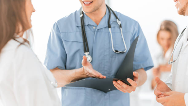 istock close up. medical colleagues discussing working papers 1284766766