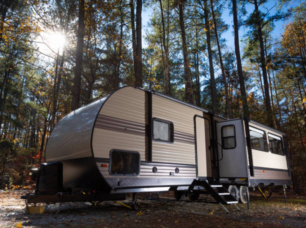 istock Camper trailer in late autumn at Jordan Lake NC 1284768149