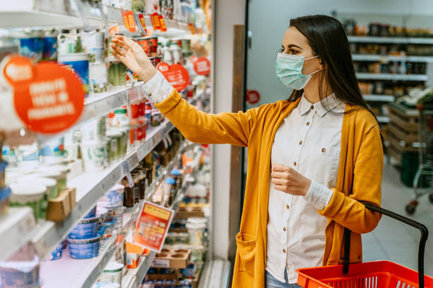 istock Woman shopping for dairy during pandemic 1284768649