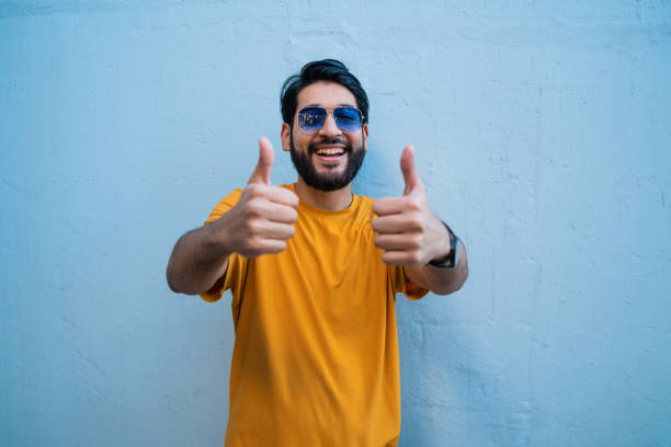 istock Young woman with thumbs up. 1284770433
