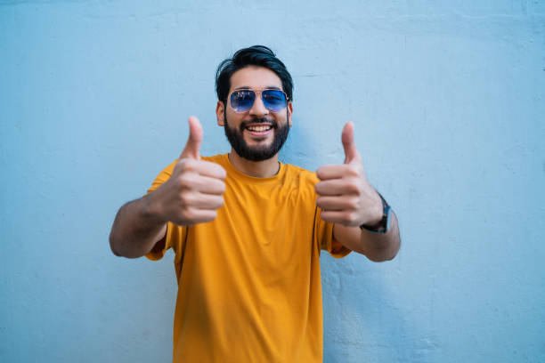 istock Young woman with thumbs up. 1284770437
