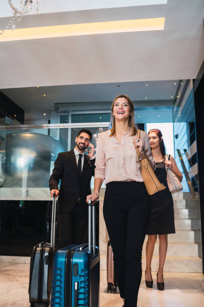 istock Business people arriving at hotel. 1284770538