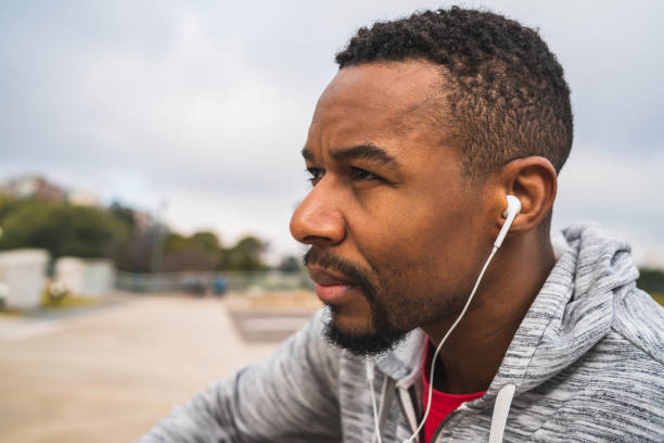 istock Athletic man listening to music. 1284770542
