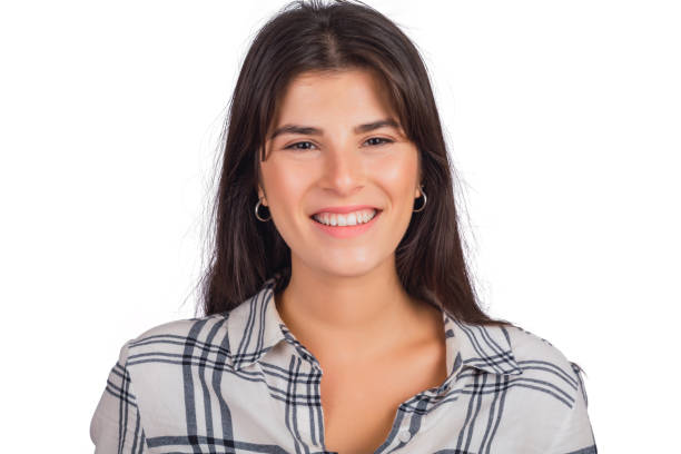istock Young woman looking at camera and smiling. 1284770605