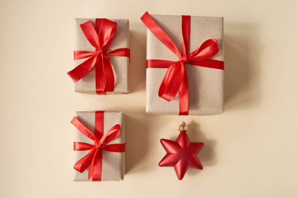 istock Presents with red ribbon on the bright background .,, 1284770753