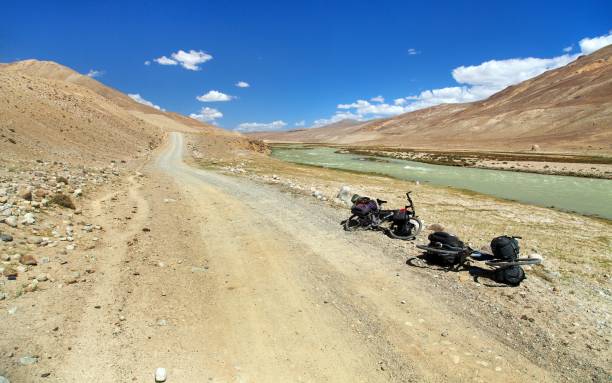 istock Pamir river, Pamir mountains, unpaved road 1284771429