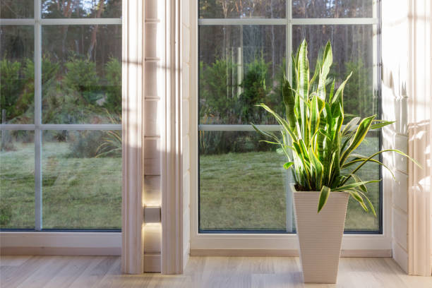 istock Bright photo studio interior with big window, high ceiling, white wooden floor 1284771560