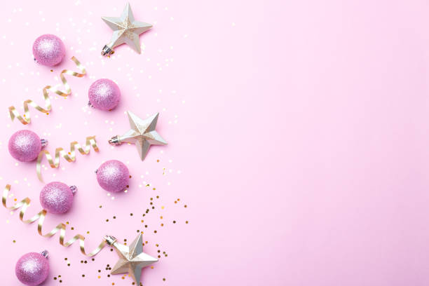 istock Christmas ornaments on pink background 1284773192