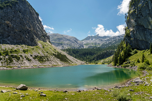 Panoramic view on the mountain lake Krn in Triglav national park on beautiful sunny day.