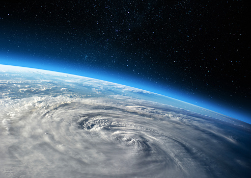Blue Earth in the space. Hurricane seen from the space over planet Earth. Storm, hurricane, typhoon - concept cataclysm. Elements of this image furnished by NASA. ______ Url(s): \nhttps://images.nasa.gov/details-iss040e088925\nSoftware: Adobe Photoshop CC 2015. Knoll light factory. Adobe After Effects CC 2017.