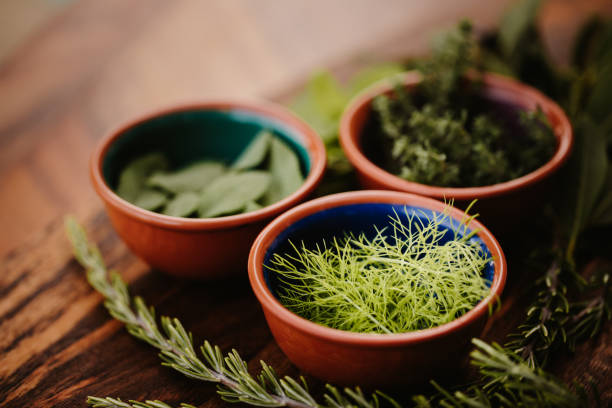 istock Three different tasty herbs on a rustic wooden board with focus on the dill 1284777350