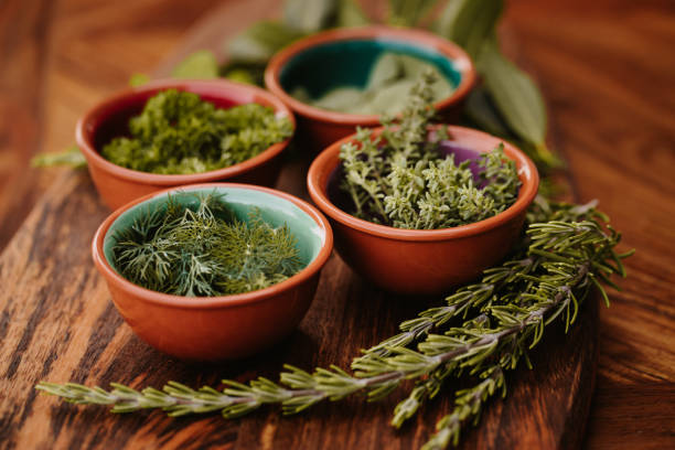 istock Four different tasty herbs on a rustic wooden board with focus on the thyme 1284777653
