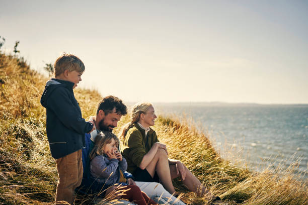 Shot of a young couple out on an adventure together with their two kids