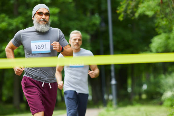 istock Two Men Finishing Marathon 1284779181