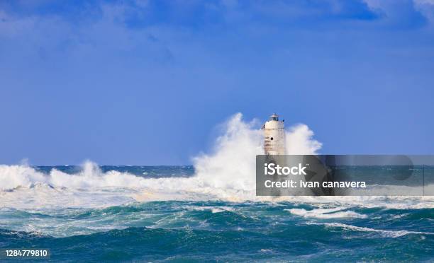 Lighthouse Of The Mangiabarche Of Calasetta In A Stormy Day Sardinia Stock Photo - Download Image Now