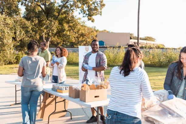 istock Diverse group volunteers for local food drive 1284781171