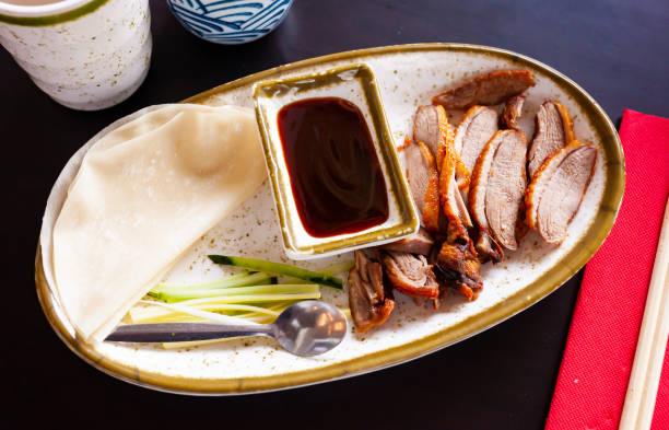 istock Peking duck with sauce and chinese pancakes 1284781684