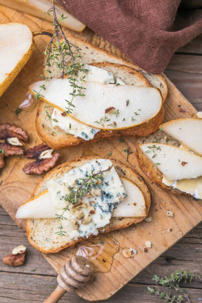 istock Toast or canape  with goat cheese, thyme, honey, nuts.  Delicious appetizer, ideal as an aperitif. 1284782884