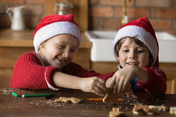 istock Cute little kids have fun baking cookies 1284784105