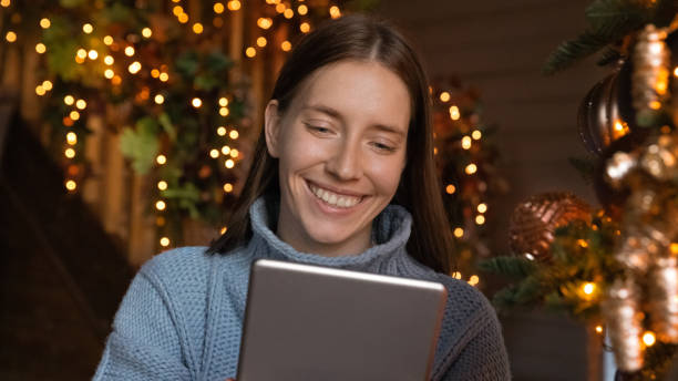 istock Banner view of happy woman use modern tablet device 1284784159