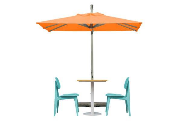 istock Outdoor Dining Table and Chairs with Orange Umbrella Isolated on White Background with Clipping Path 1284784530