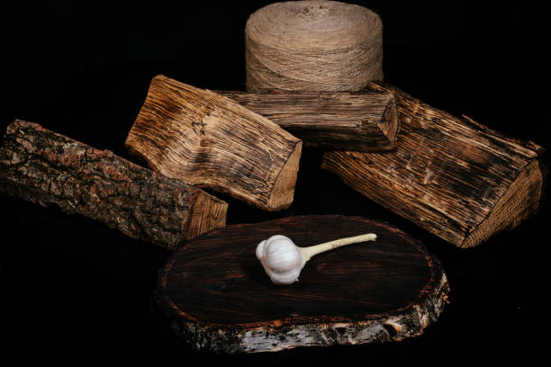 istock Garlic on a dream tree, dark wooden background, contrast. 1284784662