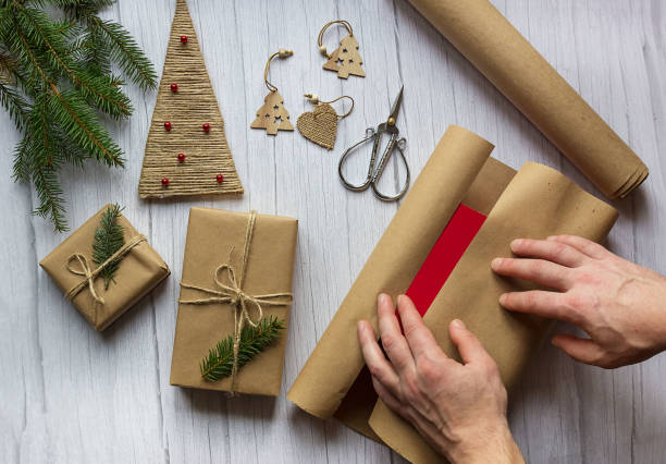 istock Man packing presents for new year and christmas 1284787372