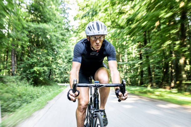 istock Adult cyclist driving through the forest 1284788101