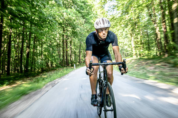istock Cyclist riding a bike through the forest 1284788161