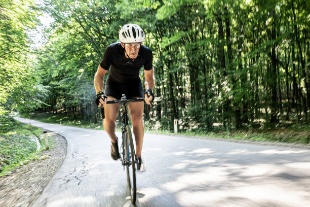 istock Adult cyclist driving through the forest 1284788251