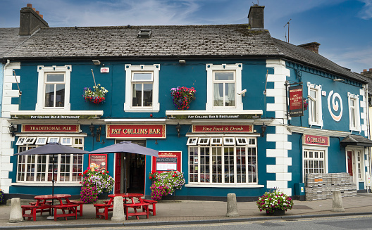 View of a typical Irish pub with a blue facade in the town of Adare.
