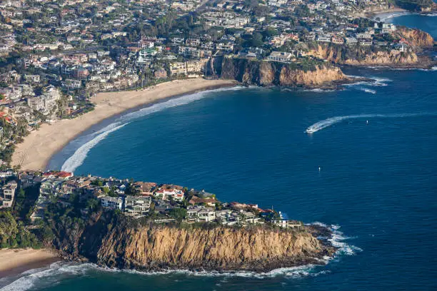 Aerial view of affluent homes surrounding scenic Emerald Cove in Laguna Beach, California.