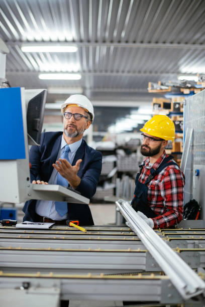 istock Quality inspector and manual worker in a factory 1284795529