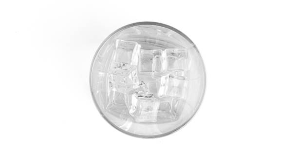 istock Ice in glass on white background 1284795575