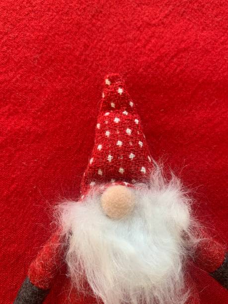 istock Christmas Gnome Elf on Red 1284795793