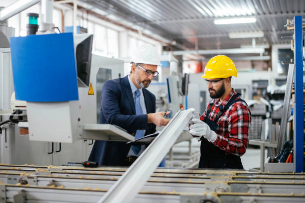 istock Quality inspector and manual worker in a factory 1284796533
