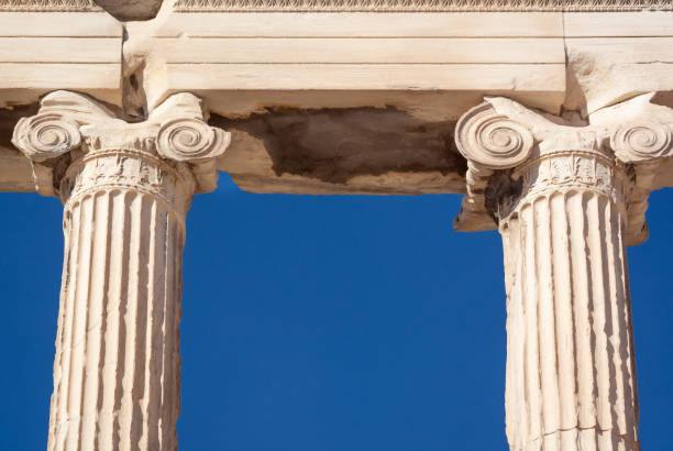 Two columns of the Ionic order against a blue sky in a horizontal format