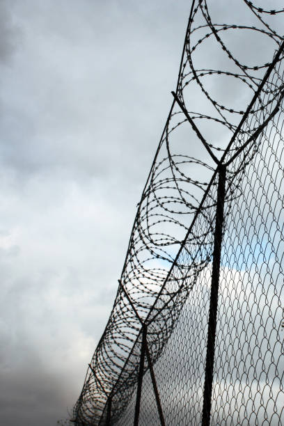 istock Security Fence used at a Prison Facility. 1284799263
